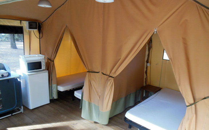 Two bedrooms and a living room with fitted kitchen